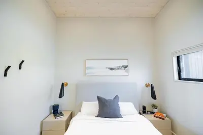 a bedroom with a bed and a window at Lakeview House by Leavetown Vacations in Lakefield