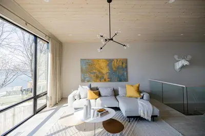 a living room with a couch and a table at Lakeview House by Leavetown Vacations in Lakefield