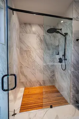 a shower with a glass door in a bathroom at Lakeview House by Leavetown Vacations in Lakefield