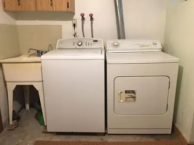 a kitchen with two machines and a sink at Beautiful house in central Toronto with backyard in Toronto