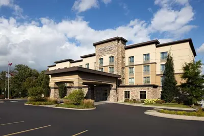 a building with a parking lot in front of it at Homewood Suites by Hilton Waterloo/St. Jacobs in Waterloo