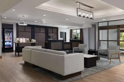 a living room with a couch and chairs at Homewood Suites by Hilton Waterloo/St. Jacobs in Waterloo