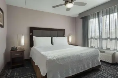 a bedroom with a large bed and a window at Homewood Suites by Hilton Waterloo/St. Jacobs in Waterloo
