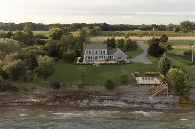 an aerial view of a house on a river at The Hull House - Lake Ontario Waterfront w Sauna in Wellington
