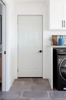 a white door in a kitchen with a dishwasher at The Hull House - Lake Ontario Waterfront w Sauna in Wellington