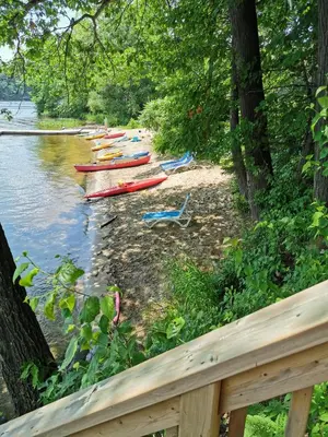 a group of canoes on the shore of a river at Muskoka Shores Cottages in Port Carling
