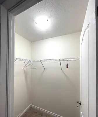 a walk in shower in a bathroom with white walls at Niagara Falls BNB 15 mins away from Falls in Thorold