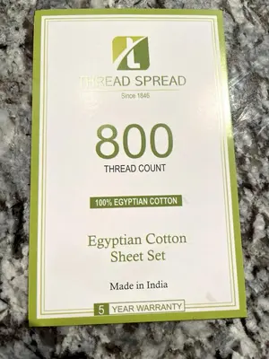 a sign for the thread spread speed limit at the evian cotton sheet set at Muskoka Lakeshore Cottage Bliss in Gravenhurst