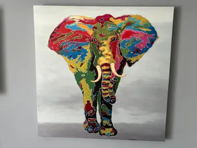 a painting of an elephant painted on a canvas at Jahsavvy's Nest in Hamilton