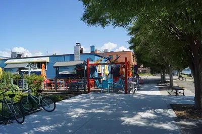 a playground with bikes parked next to a building at Pelican guest house. Village style living. Spend vacation time in Eco place! in Fort Erie