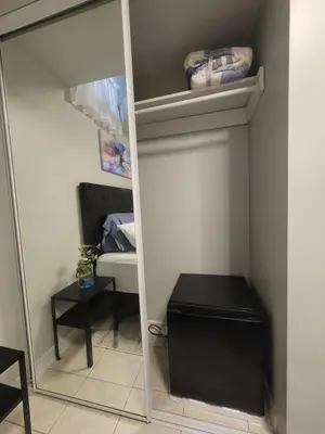 a mirror in a room with a closet at RoryHouse in Toronto