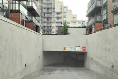 a concrete tunnel in a city with buildings at GGP Boutique Townhome in Vaughan