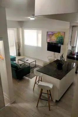 a living room with a table and a couch at GGP Boutique Townhome in Vaughan