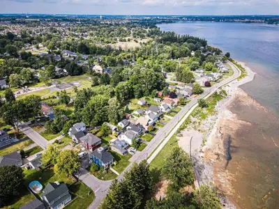 an aerial view of a town next to the water at Lake view cottage with three ensuites and elevator in Fort Erie