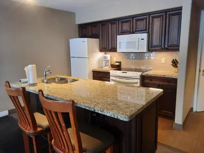 a kitchen with a large island with a counter top at Margarita Vacation Getaway in Oro-Medonte