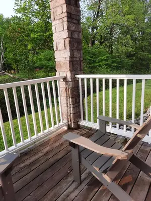a wooden bench sitting on a wooden deck at Margarita Vacation Getaway in Oro-Medonte