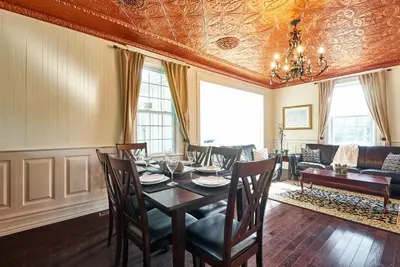 a dining room with a table and chairs at Bramasole Bed and Breakfast in Roseneath