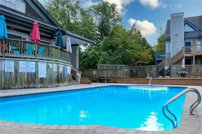 a swimming pool at a resort with a building at Blue Mountain at your Door Step in Blue Mountains