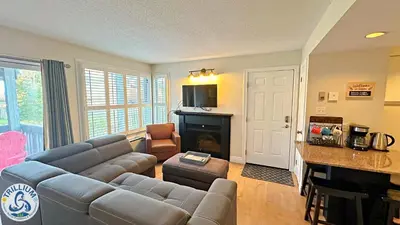 a living room with a couch and a table at Blue Mountain at your Door Step in Blue Mountains