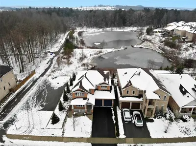 an aerial view of a house with snow covered roofs at Affordable Room with FREE Parking in Newmarket ON in Newmarket
