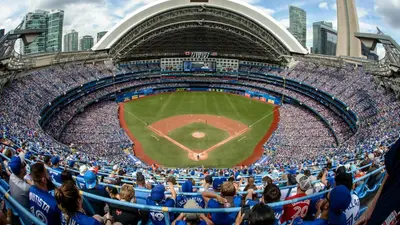 a crowd watching a baseball game in a stadium at Luxury King Bed Condo with Stunning City Views in Toronto