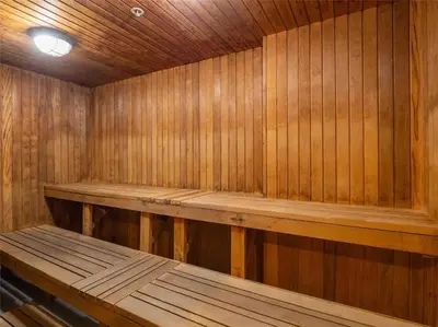 a wooden sauna with a wooden bench in it at Lakeview Condo in Downtown with Free Parking. in Toronto