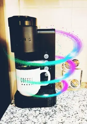 a coffee maker on a counter with a green cord at Lakeview Condo in Downtown with Free Parking. in Toronto