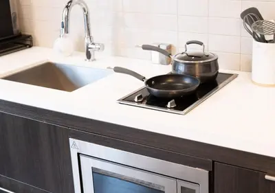 a frying pan on top of a stove in a kitchen at One of Toronto s finest 1BR Condo with a WFH Setup in Toronto