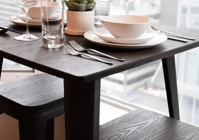 a wooden table with a plate and a bowl on it at One of Toronto s finest 1BR Condo with a WFH Setup in Toronto