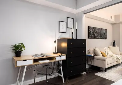 a living room with a desk and a couch at One of Toronto s finest 1BR Condo with a WFH Setup in Toronto