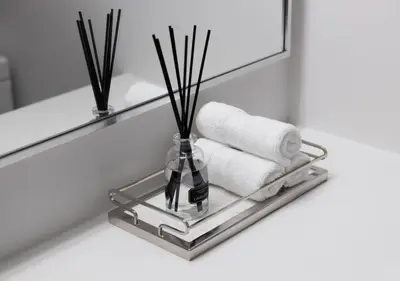 a bathroom counter with a shelf with a vase and towels at One of Toronto s finest 1BR Condo with a WFH Setup in Toronto