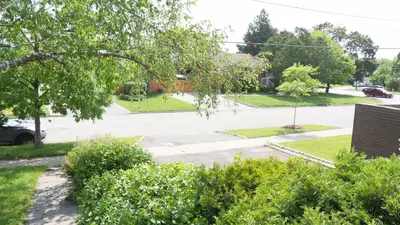 a view of a street with a parking lot at Richview Gardens Suite, 3-bdr in Toronto