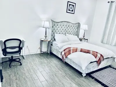 a bedroom with a bed and a desk and a chair at Lavida Luxury Room #1 in London in London