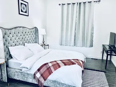 a bedroom with a bed with white sheets and pillows at Lavida Luxury Room #1 in London in London