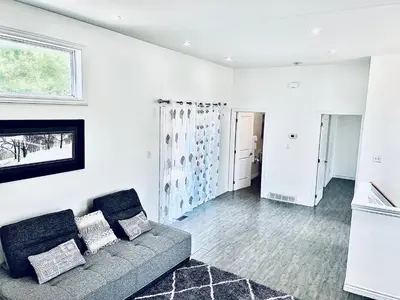a living room with a couch and a fireplace at Lavida Luxury Room #1 in London in London