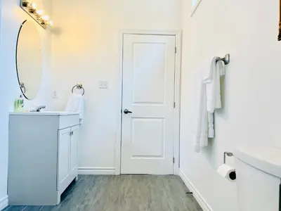 a white bathroom with a sink and a mirror at Lavida Luxury Room #1 in London in London