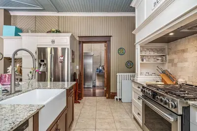 a large kitchen with a sink and a stove at Lakehurst Estate in Cobourg