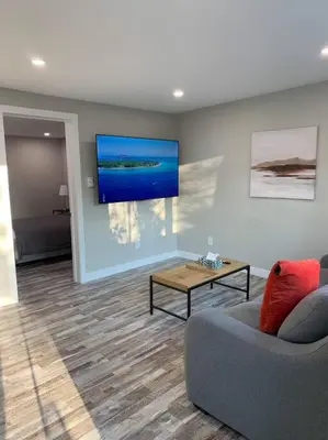 a living room with a couch and a table at ENTIRE 2 BEDROOM APARTMENT DOWNTOWN - u5 in Waterloo