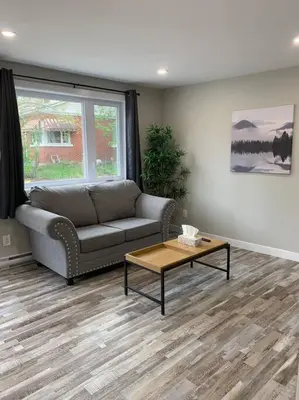 a living room with a couch and a coffee table at ENTIRE 1 BEDROOM APARTMENT DOWNTOWN - u4 in Waterloo