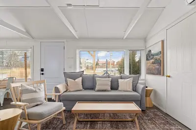 a living room with a couch and a table at The Birch in Wellington