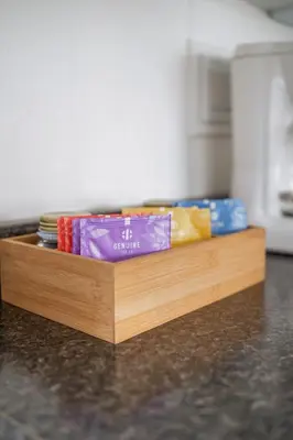 a wooden counter top with books on top of it at The Birch in Wellington