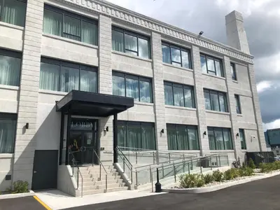an office building with the entrance to the building at Cannery Lofts Niagara in Niagara Falls
