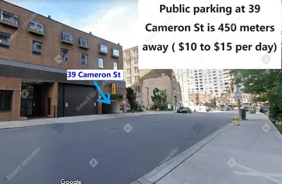 an empty street in a city with a sign for a parking lot at BUDGET Triple Room with En Suite Bathroom 36A in Toronto