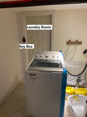 a kitchen with a key box and a laundry room at BUDGET Triple Room with En Suite Bathroom 36A in Toronto