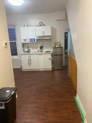 an empty room with a kitchen and a hallway at BUDGET Quad Room with En Suite Bathroom 36B in Toronto