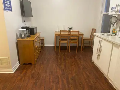 a room with a kitchen with a table and a dining room at BUDGET Quad Room with En Suite Bathroom 36B in Toronto