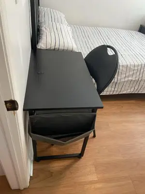 a black desk in a room with a bed at Double Room with SHARED Bathroom 536B in Toronto