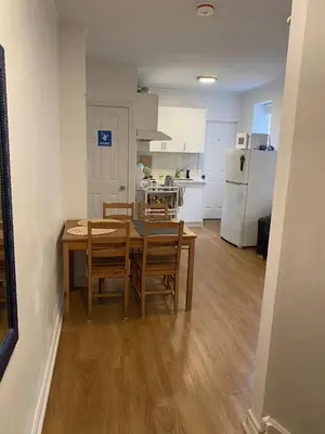 a kitchen and dining room with a table and chairs at Double Room with SHARED Bathroom 536B in Toronto