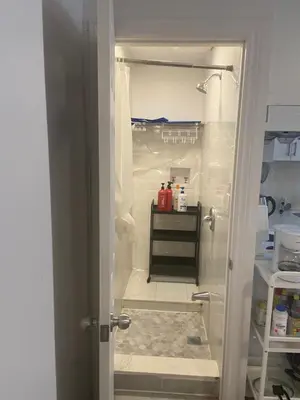 an open door to a kitchen with a refrigerator at Double Room with SHARED Bathroom 536B in Toronto