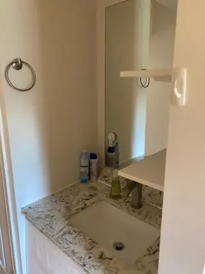 a bathroom with a sink and a mirror at Single Room with SHARED Bathroom 536C in Toronto